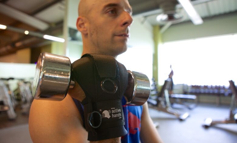 Rob-Smith-using-general-purpose-gripping-aid-to-hold-weight-in-gym-780x470