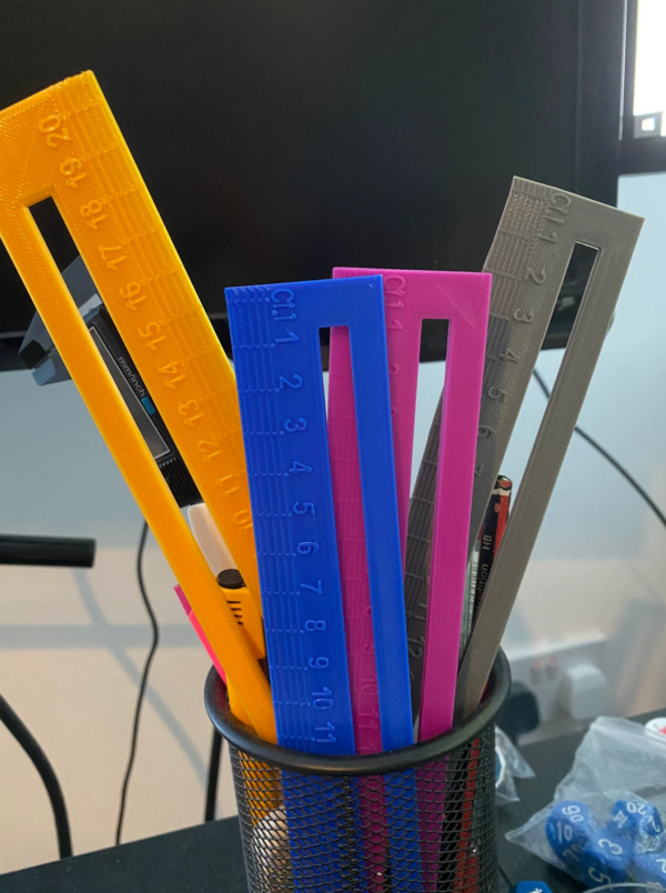 a range of dyslexia aid rulers in a pot on a desk, these can also be used to help accountants and bookkeepers isolate difficult to read lines of handwritten numbers
