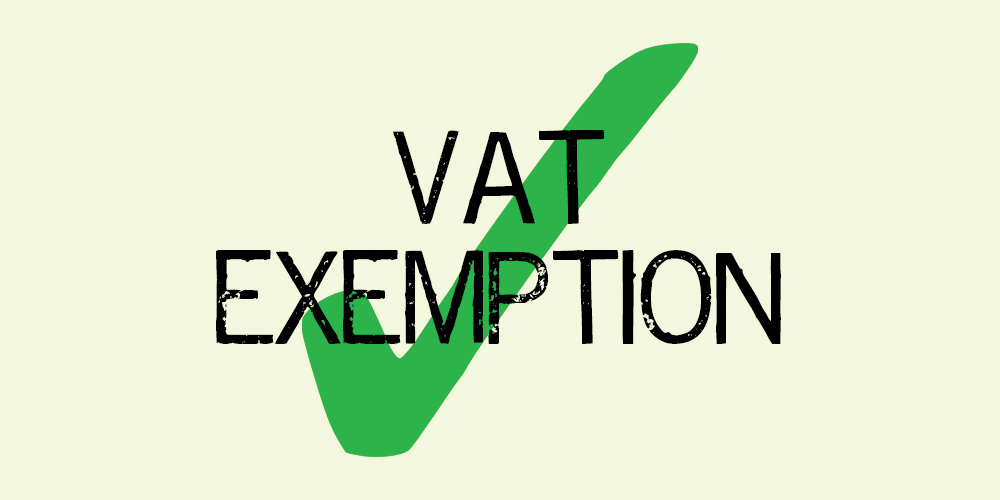 The words VAT exemption in black capital letters with a big green tick behind them