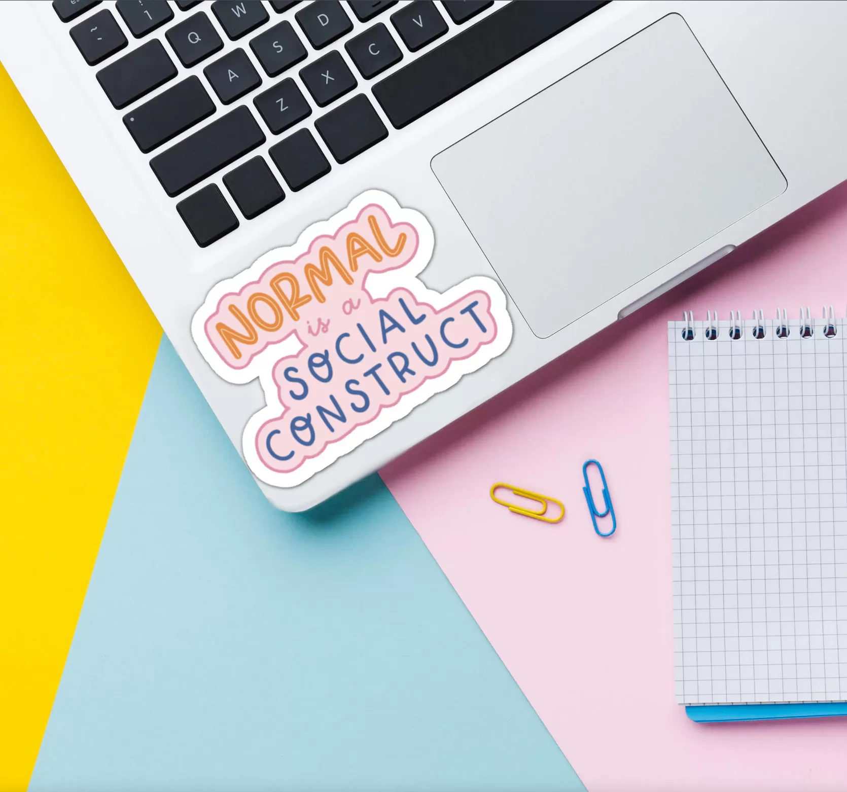 normal is a social construct sticker stuck to laptop