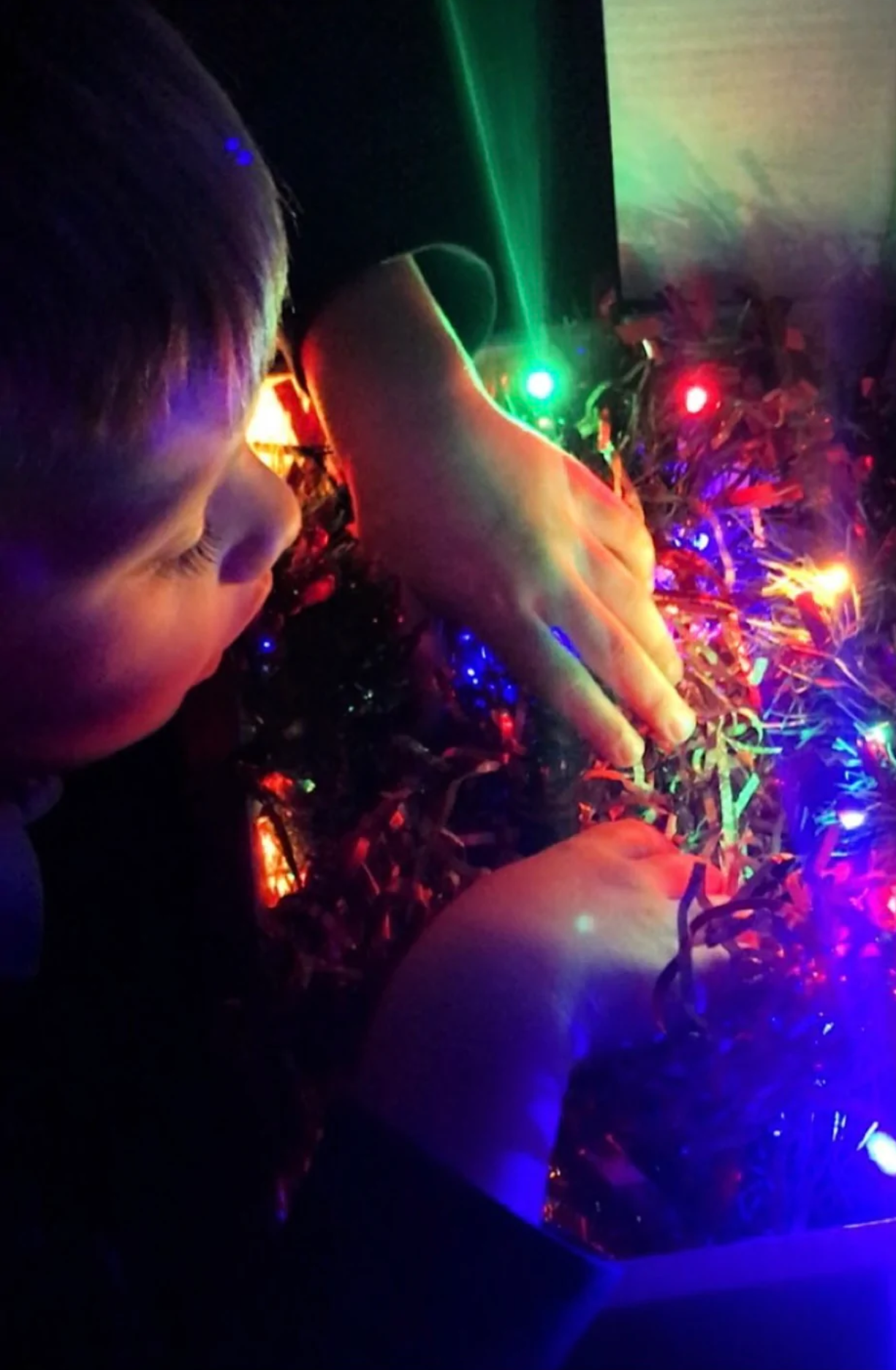 Child playing with Christmas sensory box.