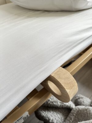 Side view of the bed wedge mattress lifter underneath the mattress