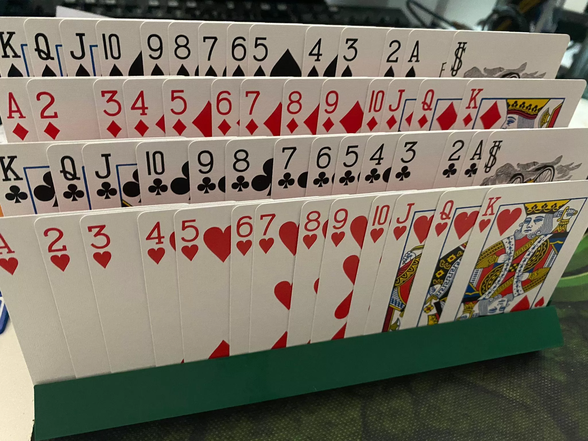 Card holder showing four rows of playing cards