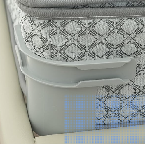 Grey plastic moulding that goes around the corner of a mattress. A plastic sheet gripper is clipped onto the side of a mattress to help hold a fitted sheet in place.