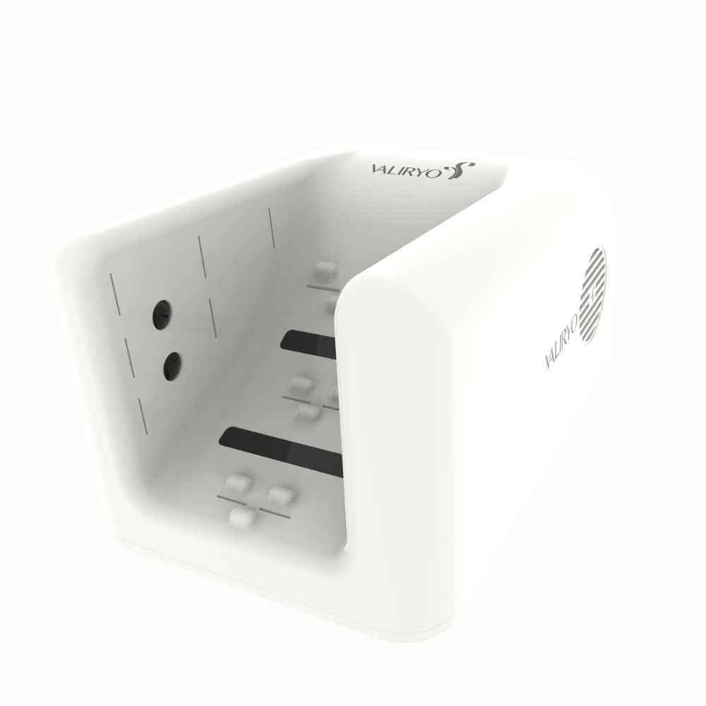 Compact white foot dryer with air vents and raised nodules for foot placement, branded “Valiryo.”