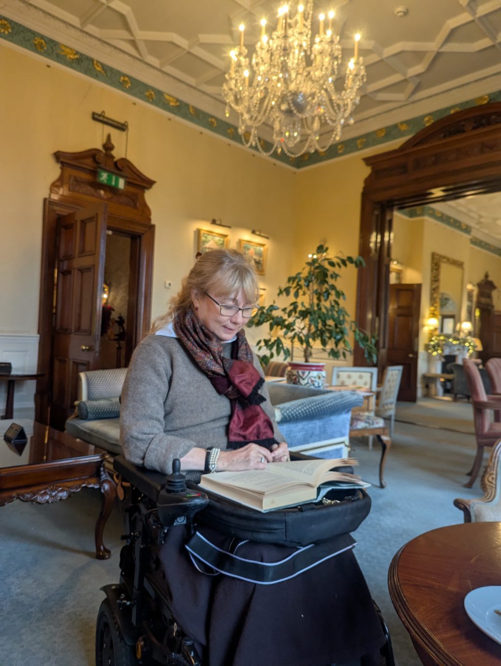 Clare the inventor of trabasack curve with a trabasack reading in a hotel lounge
