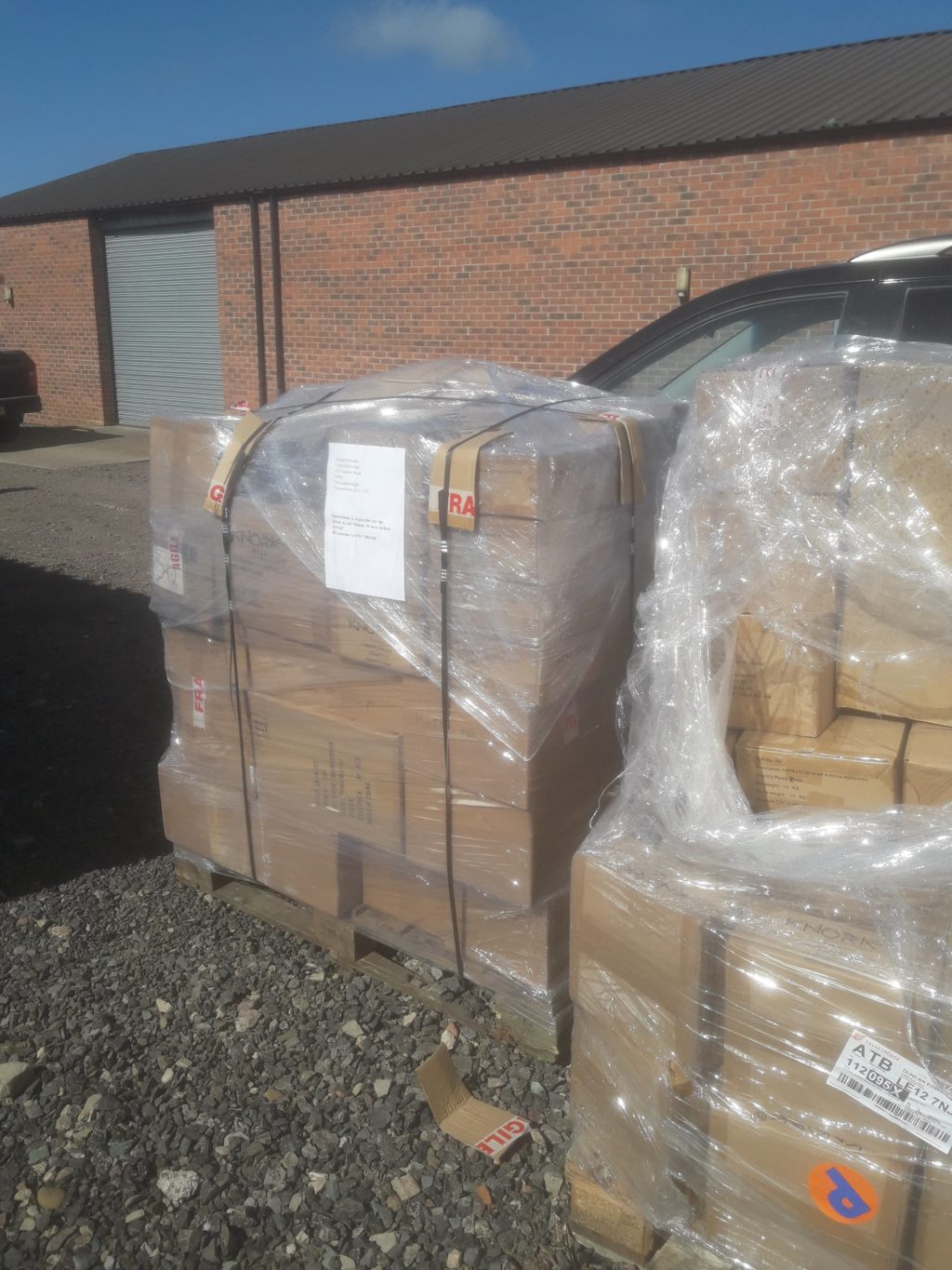 Pallets of newly arrived Trabasack stock outside the warehouse before unloading.